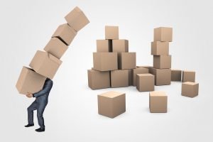 A man carrying some boxes. - Office movers suburbs can help you with this task.