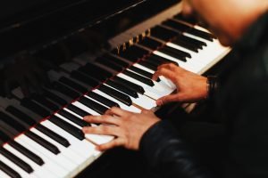A man playing a piano.