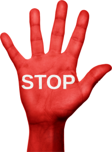 A red hand with "stop" word written on it