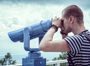 man with a telescope - do enough research before accepting moving company referrals